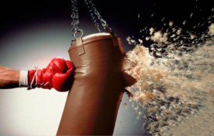 Image of a boxing glove exploding a punching bag